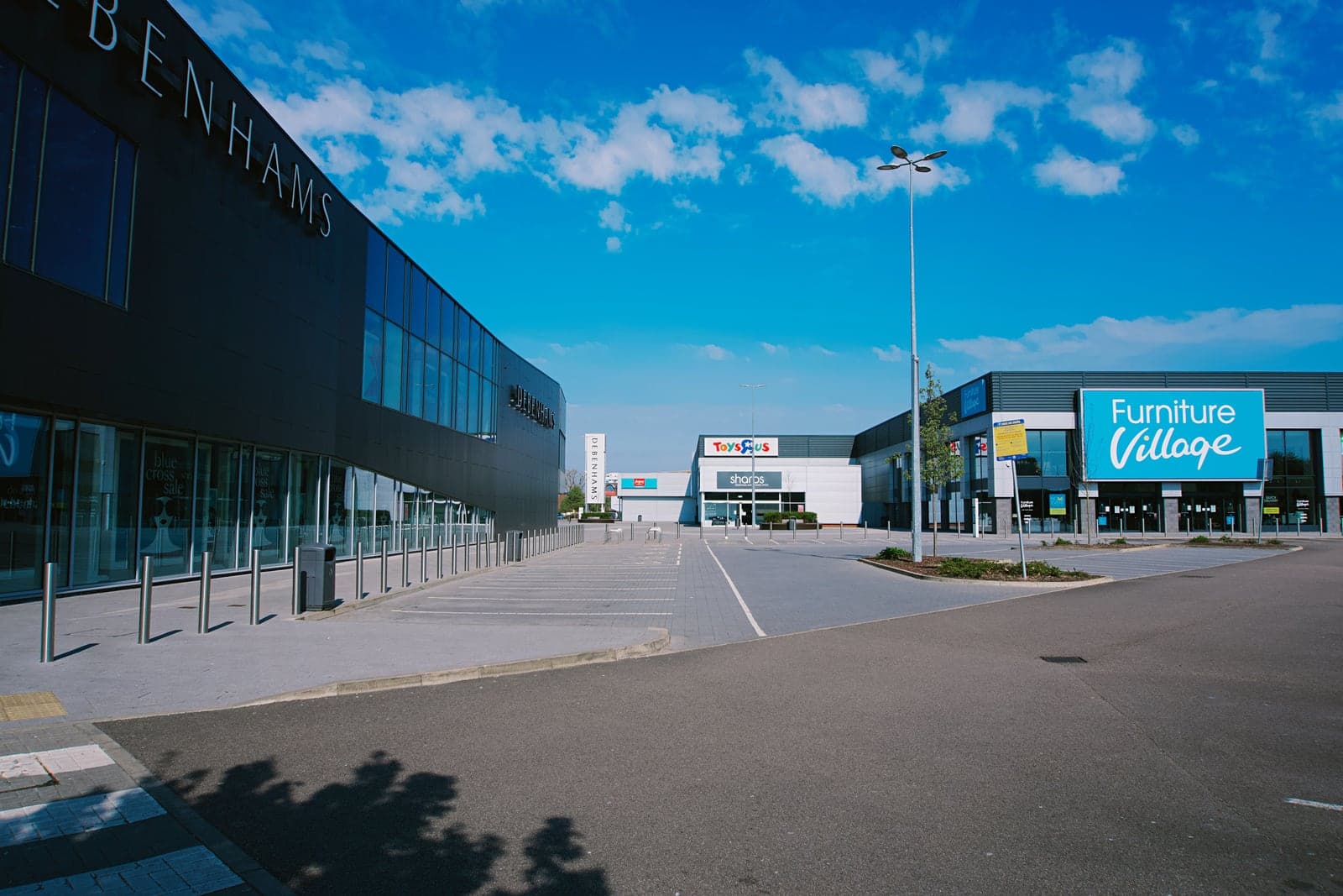 Retail shopping center with multiple storefronts and a shared parking area