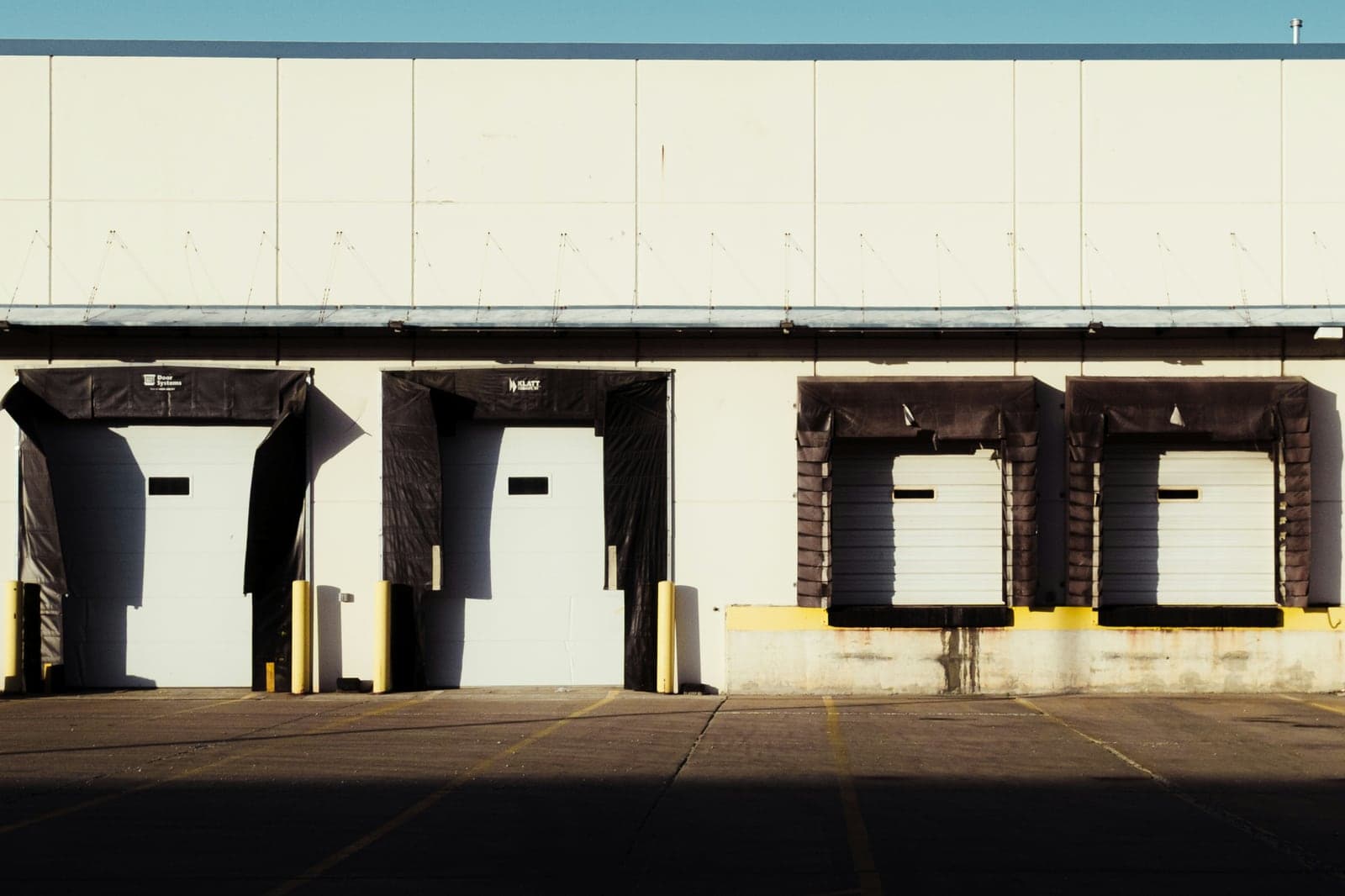 Loading dock doors and paved truck access at a warehouse building